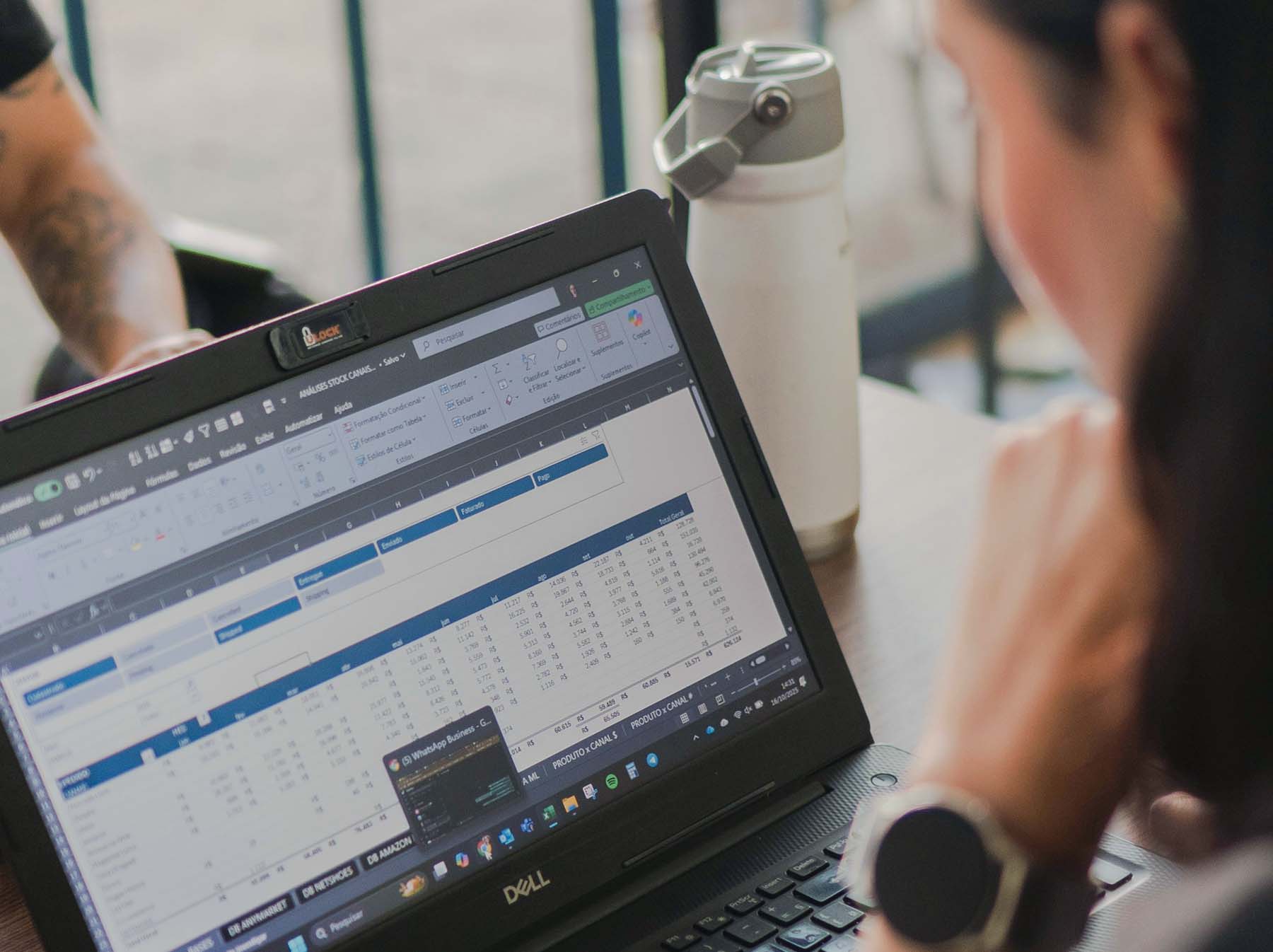 A business team reviewing operational data held in spreadsheets